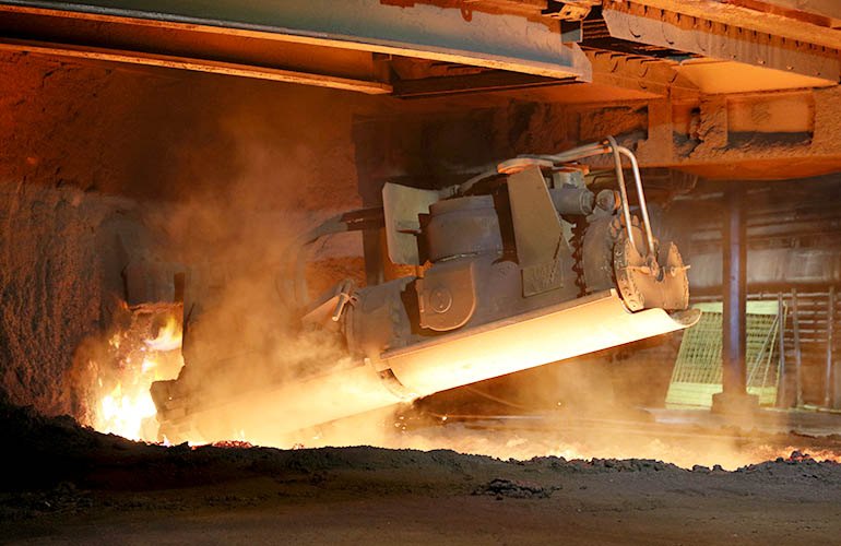 Molten metallic iron is tapped from the bottom of the blast furnace. In the conventional ore-based steelmaking process iron ore pellets are converted to metallic iron by reduction in a blast furnace using coking coal.